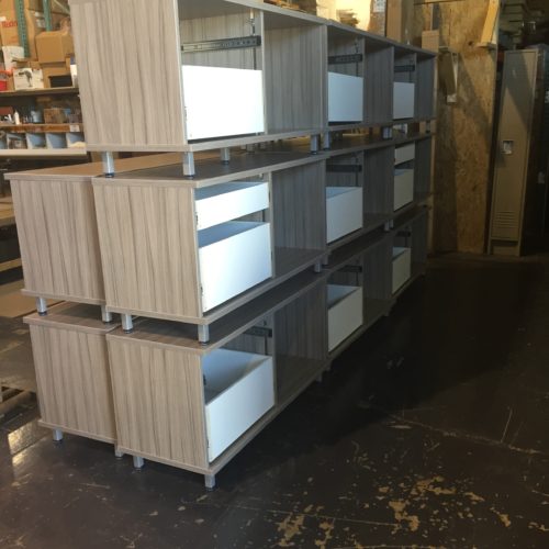 Wooden drawers with white boxes